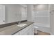 Modern bathroom featuring white cabinets, gray counters, and tile flooring at 9140 Dupree Meadow Dr # 9, Angier, NC 27501
