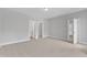 Large bedroom with carpeted floors and two doorways leading to other rooms at 9140 Dupree Meadow Dr # 9, Angier, NC 27501