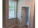 Bedroom featuring a bright window overlooking the outside, with a doorway to another room at 9140 Dupree Meadow Dr # 9, Angier, NC 27501