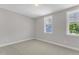 Neutral bedroom with two windows allowing ample natural light at 9140 Dupree Meadow Dr # 9, Angier, NC 27501