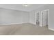 Spacious bedroom featuring neutral carpet and two open doorways at 9140 Dupree Meadow Dr # 9, Angier, NC 27501