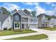 Charming two-story home with a welcoming front porch and attached two car garage at 9140 Dupree Meadow Dr # 9, Angier, NC 27501