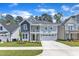 Charming two-story home with a welcoming front porch and attached two car garage at 9140 Dupree Meadow Dr # 9, Angier, NC 27501