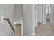 Hallway with carpeted flooring and view into rooms with wood flooring at 9140 Dupree Meadow Dr # 9, Angier, NC 27501