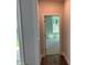 Hallway view of the room with neutral carpet, a view of the wooded landscape can be seen through the window at 9140 Dupree Meadow Dr # 9, Angier, NC 27501
