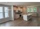 Spacious kitchen with white cabinetry, stainless steel appliances, and a center island at 9140 Dupree Meadow Dr # 9, Angier, NC 27501