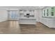 Modern kitchen with island, stainless appliances, and plenty of natural light, offering style and functionality at 9140 Dupree Meadow Dr # 9, Angier, NC 27501