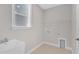 Well-lit laundry room featuring a utility sink and washer/dryer hookups at 9140 Dupree Meadow Dr # 9, Angier, NC 27501