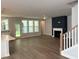 Open-concept living room featuring hardwood floors, fireplace, and an abundance of natural light at 9140 Dupree Meadow Dr # 9, Angier, NC 27501