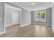 Spacious living room with hardwood floors and natural light from large windows at 9140 Dupree Meadow Dr # 9, Angier, NC 27501