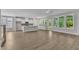 Bright living room flows to the modern kitchen and features a patio entrance with green outdoor views at 9140 Dupree Meadow Dr # 9, Angier, NC 27501
