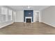 Spacious living room features a modern fireplace, large windows, and luxury vinyl plank flooring at 9140 Dupree Meadow Dr # 9, Angier, NC 27501