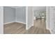 Open-concept living space with hardwood floors and seamless flow to kitchen at 9140 Dupree Meadow Dr # 9, Angier, NC 27501
