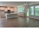 Open-concept living space featuring a modern kitchen and a living room at 9140 Dupree Meadow Dr # 9, Angier, NC 27501