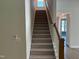Carpeted staircase leading to the upper level of the home at 9140 Dupree Meadow Dr # 9, Angier, NC 27501