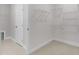 Spacious walk-in closet with ample shelving and neutral carpet at 9140 Dupree Meadow Dr # 9, Angier, NC 27501