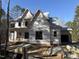 New construction home with wrap-around porch and large windows at 1317 Old Lystra Rd, Chapel Hill, NC 27517