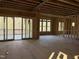 Spacious living room with large windows and sliding glass doors to a deck at 1317 Old Lystra Rd, Chapel Hill, NC 27517