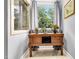 Peaceful bathroom nook with a window and wood accent table at 4028 Dutch Harbor Ct, Raleigh, NC 27606