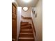 Elegant wooden staircase with unique design and tasteful wall decor at 4028 Dutch Harbor Ct, Raleigh, NC 27606