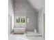 Elegant bathroom with freestanding tub, walk-in shower, and patterned tile at 5312 Alpine Dr, Raleigh, NC 27609