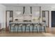 Modern kitchen with island, stainless steel appliances, and white cabinets at 5312 Alpine Dr, Raleigh, NC 27609