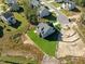 Aerial shot of a home in a suburban neighborhood with green lawns and new construction nearby at 820 Willow Tower Ct # 153, Rolesville, NC 27571