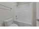 Bathroom featuring a combination bathtub and shower with tiled walls at 820 Willow Tower Ct # 153, Rolesville, NC 27571