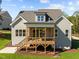 Home exterior features a screened porch, gray siding, and a well-maintained lawn at 820 Willow Tower Ct # 153, Rolesville, NC 27571