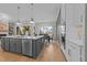Open kitchen view into dining area, featuring stainless steel appliances and an island with seating at 820 Willow Tower Ct # 153, Rolesville, NC 27571