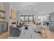 Spacious living room with a cozy fireplace, sliding glass doors to the porch and modern decor at 820 Willow Tower Ct # 153, Rolesville, NC 27571