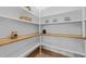 Walk-in pantry with wooden countertops and open shelving for ample storage at 820 Willow Tower Ct # 153, Rolesville, NC 27571