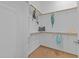 An organized walk-in closet with wooden floors and rods for ample storage space at 820 Willow Tower Ct # 153, Rolesville, NC 27571