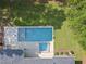 Aerial view of a private backyard featuring a modern in-ground pool, a hot tub, and landscaped outdoor living spaces at 4123 Rockingham Dr, Raleigh, NC 27609