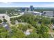 Aerial view of property showing its location near office buildings and lush trees at 4123 Rockingham Dr, Raleigh, NC 27609