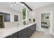 Contemporary bathroom featuring a double vanity and modern lighting at 4123 Rockingham Dr, Raleigh, NC 27609