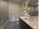 Contemporary bathroom featuring a glass-enclosed shower and stylish vanity lighting and fixtures at 4123 Rockingham Dr, Raleigh, NC 27609