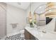 Modern bathroom featuring unique flooring and decorative hanging lights at 4123 Rockingham Dr, Raleigh, NC 27609
