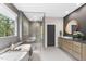 Bright bathroom featuring a freestanding tub, glass-enclosed shower, and double sink vanity at 4123 Rockingham Dr, Raleigh, NC 27609