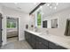 Sleek bathroom with double sinks, and a view of the bedroom from the doorway at 4123 Rockingham Dr, Raleigh, NC 27609