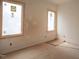 Well-lit bedroom featuring large windows at 4123 Rockingham Dr, Raleigh, NC 27609