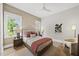 Cozy bedroom featuring a neutral color scheme and two large windows at 4123 Rockingham Dr, Raleigh, NC 27609
