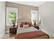 Bright bedroom featuring a neutral color scheme and two large windows at 4123 Rockingham Dr, Raleigh, NC 27609