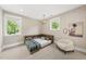 Stylish bedroom with a built-in bed, unique wallpaper, and two windows at 4123 Rockingham Dr, Raleigh, NC 27609