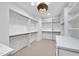 Spacious walk-in closet with ample shelving and hanging space at 4123 Rockingham Dr, Raleigh, NC 27609