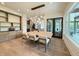 Beautiful dining room showcasing a modern chandelier, dining table and view to living spaces at 4123 Rockingham Dr, Raleigh, NC 27609