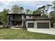 Stunning modern two-story home featuring a two-car garage and a beautifully landscaped front yard at 4123 Rockingham Dr, Raleigh, NC 27609