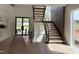 Bright foyer featuring an open staircase, modern design and a sleek entry with plenty of light at 4123 Rockingham Dr, Raleigh, NC 27609
