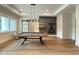 Bright game room featuring recessed lighting, a modern pool table, and a built in cue rack at 4123 Rockingham Dr, Raleigh, NC 27609