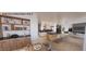 Illustration of a spacious open-concept great room, kitchen, and dining area with modern finishes and ample seating at 4123 Rockingham Dr, Raleigh, NC 27609